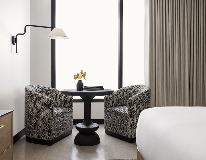 two chairs with black table